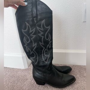 Tall black cowboy boots